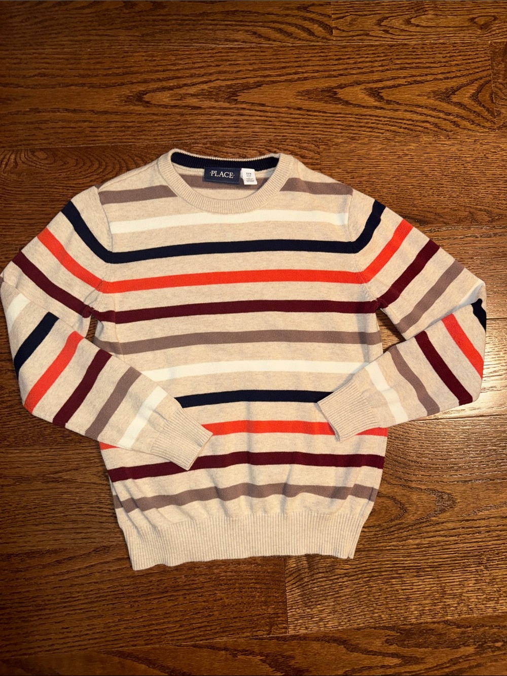 Size 7-8/M boys crewneck striped sweater.